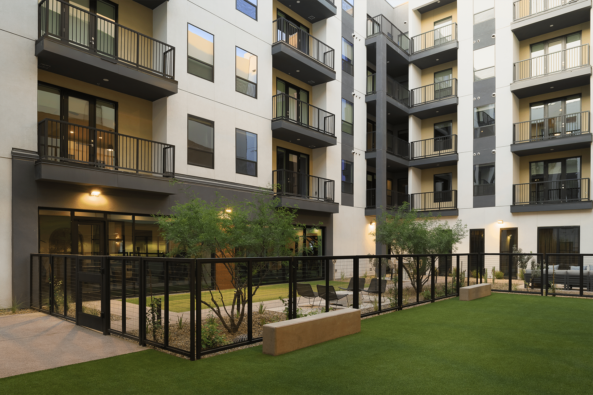 Smith & Rio building with balconies overlooking a communal courtyard with landscaping.