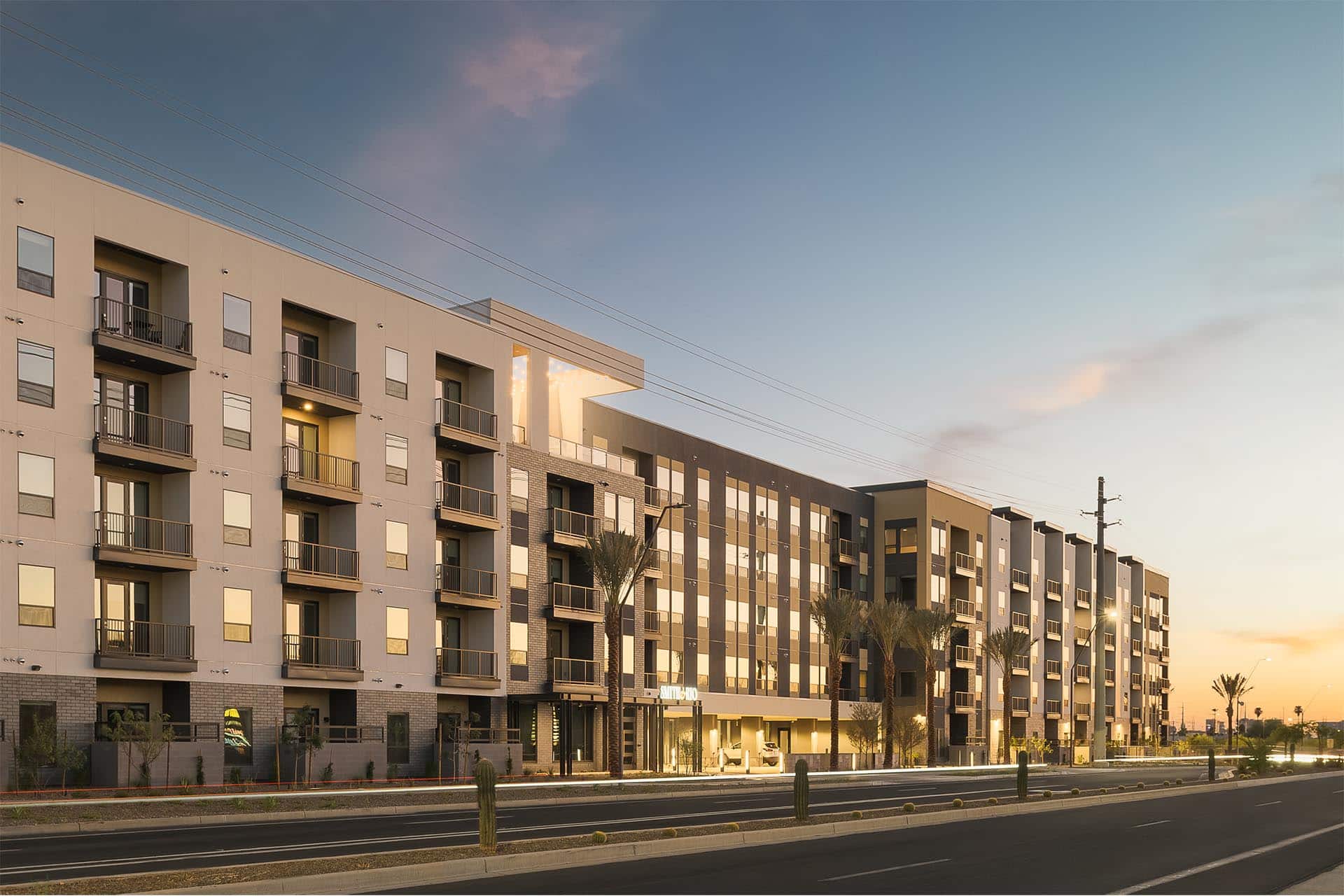 Smith & Rio building in Tempe with street lights on.